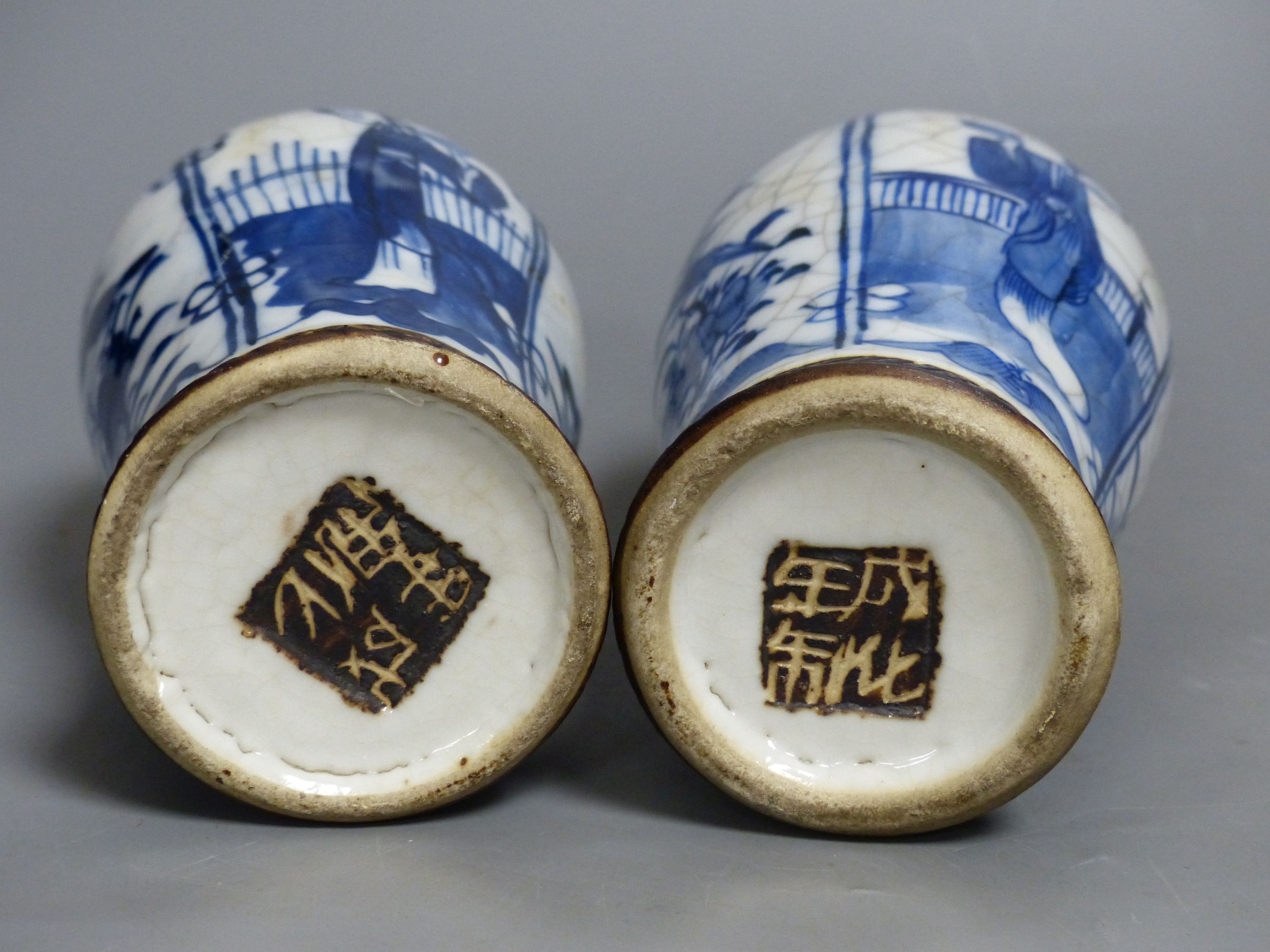 A pair of Chinese blue and white crackle glaze vases and covers, early 20th century, height 22cm